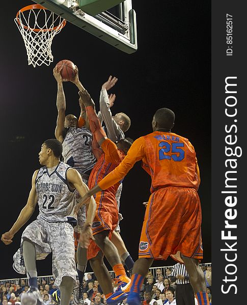 A game of basketball with the Florida Gators playing against Georgetown Hoyas. A game of basketball with the Florida Gators playing against Georgetown Hoyas.