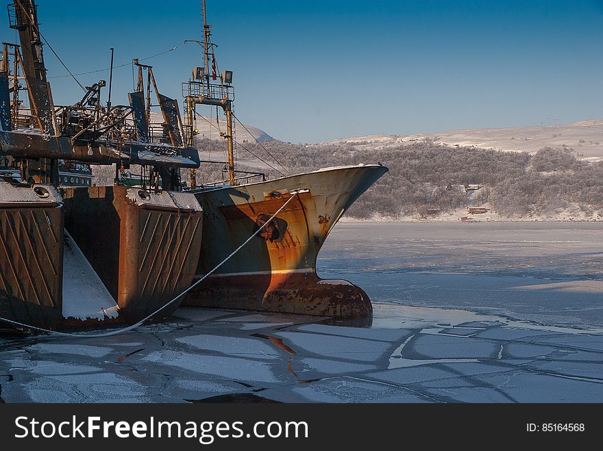 An old ship in the ice in the harbor int the winter. An old ship in the ice in the harbor int the winter.