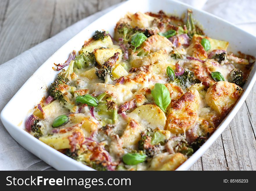 A baked casserole with vegetables, meat and cheese.