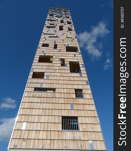A tall modern building from low angle.