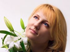 Beautiful Young Woman With Lily Flower Royalty Free Stock Photography