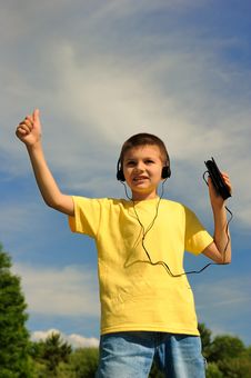 Boy Listens To Music Royalty Free Stock Photography Boy Listens To Music Royalty Free Stock Photography