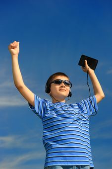 Boy Listens To Music Royalty Free Stock Photography Boy Listens To Music Royalty Free Stock Photography