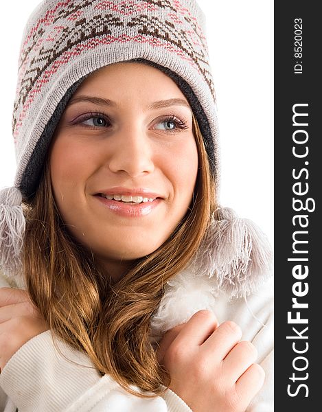 Shivering smiling woman with cap against white background