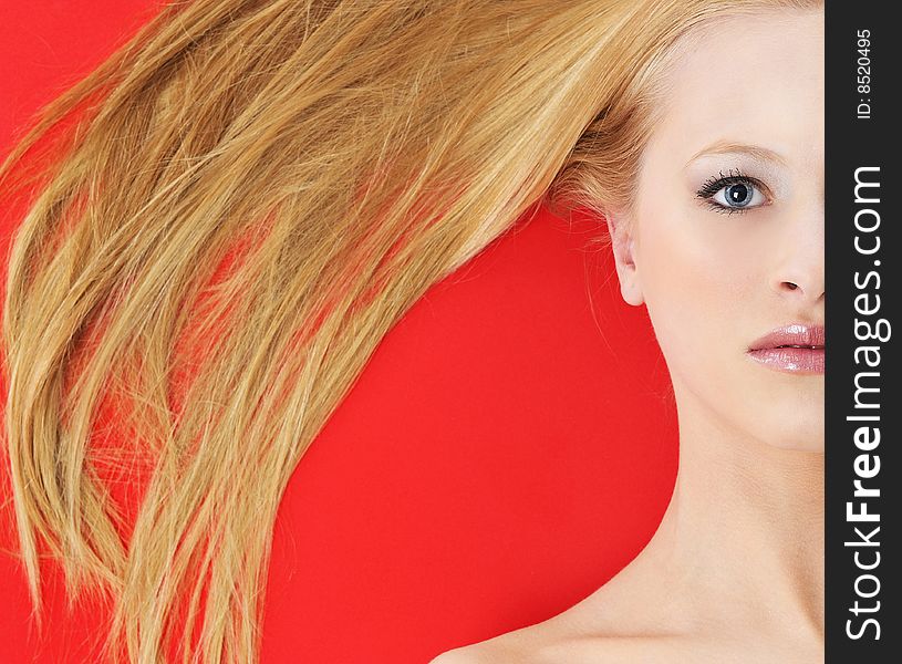 Beautiful blond woman and red background. Beautiful blond woman and red background