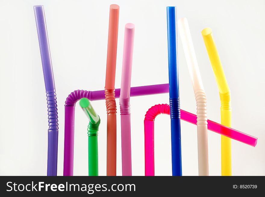 Many color cocktail straws isolated on white