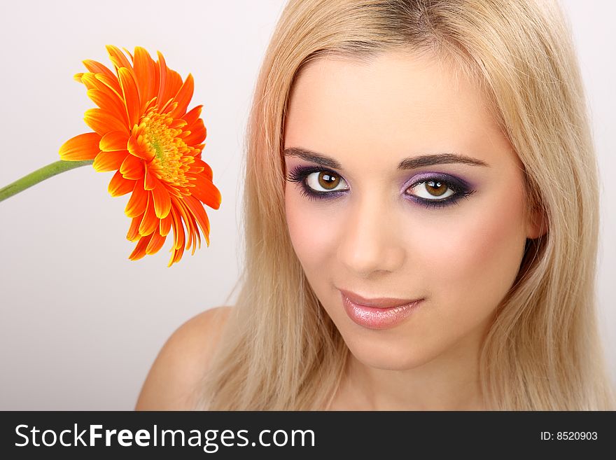 Young fashion woman with gerbera. Young fashion woman with gerbera