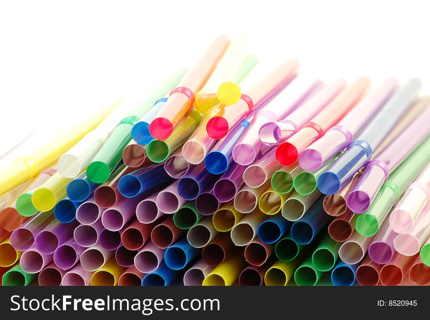 Many color cocktail straws isolated on white