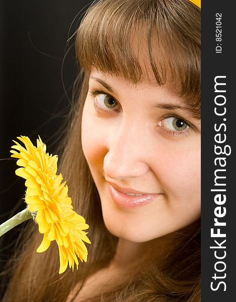 Portrait Of Beautiful Girl With Yellow Flower
