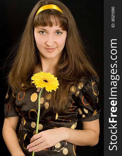 Portrait Of Beautiful Girl With Yellow Flower