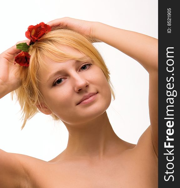 Young beautiful girl blonde with a flower in hairs. Young beautiful girl blonde with a flower in hairs