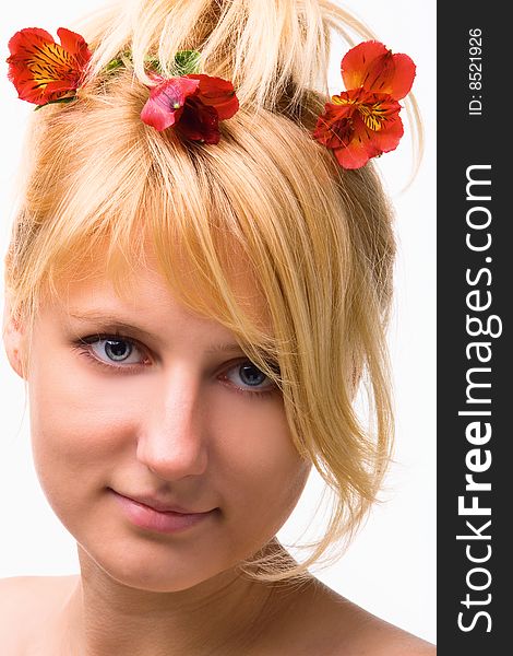 Young beautiful girl blonde with a flower in hairs. Young beautiful girl blonde with a flower in hairs