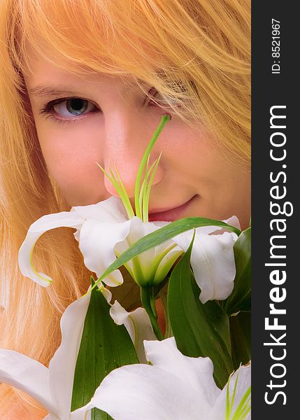 Beautiful young woman a blonde with lily flower. Beautiful young woman a blonde with lily flower