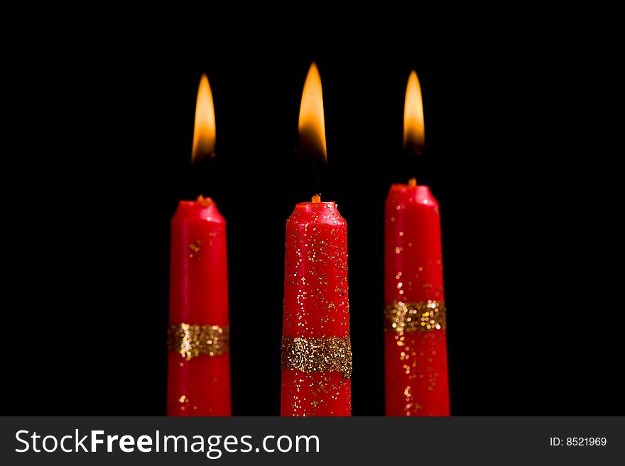 Beautiful red candles against a dark background