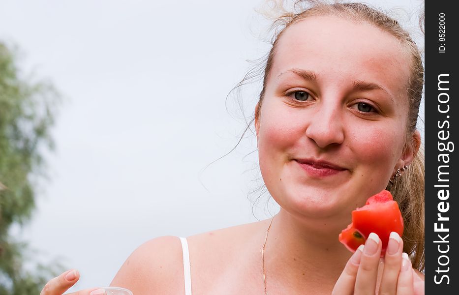 Funny young girl with red tomato. Funny young girl with red tomato.