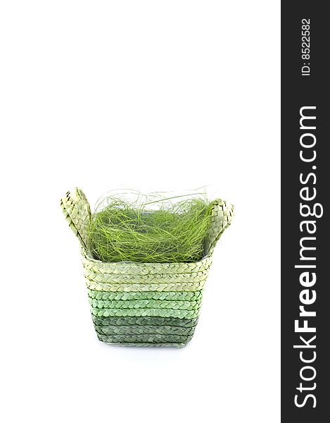 Easter basket with grass isolated on white.Place for text