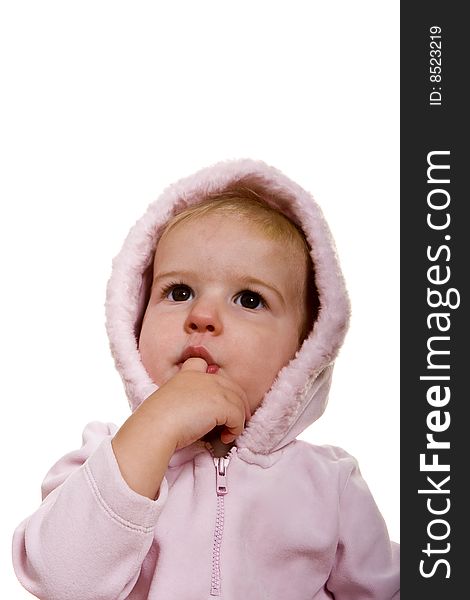 A cute baby in a pink jacket and hood on white. A cute baby in a pink jacket and hood on white