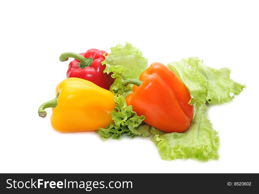 Yellow, red and orange pepper on a white background