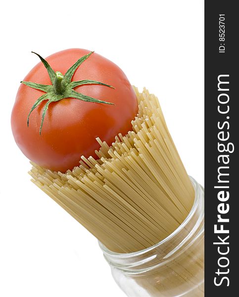 Spaghetti and mature tomato isolated on a white background. Spaghetti and mature tomato isolated on a white background