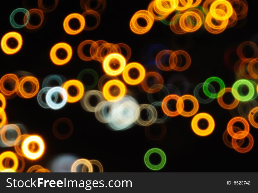 Doughnut bokeh abstract colorful background made by a mirror lens. Doughnut bokeh abstract colorful background made by a mirror lens