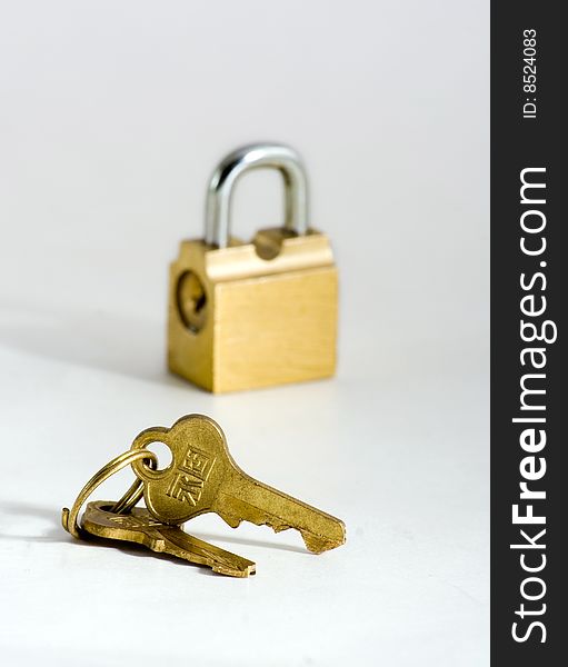 Key and lock of the wanted colour on white background