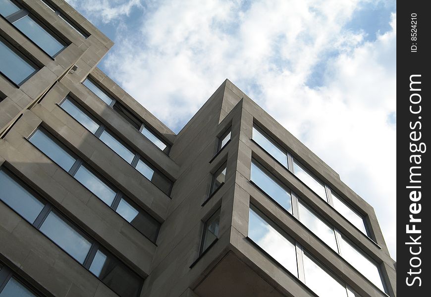 Modern concrete building and cloudy sky