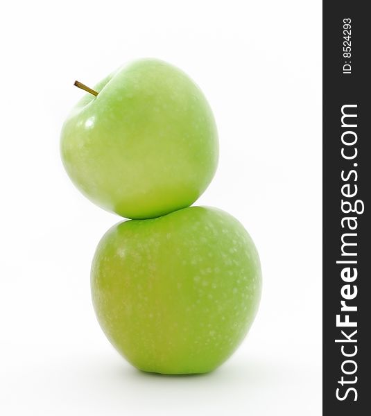 Two juicy green apples on a white background. Two juicy green apples on a white background
