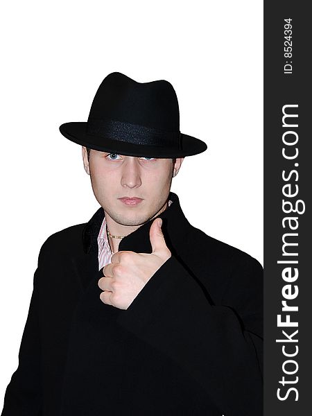 The gentleman in a hat and in a coat on a white background