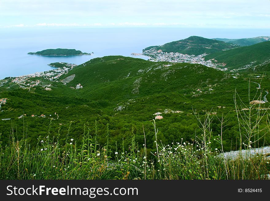 Bird-eye view on coastline and town in highlands