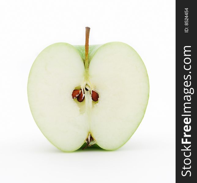 Half of juicy green apple on a white background