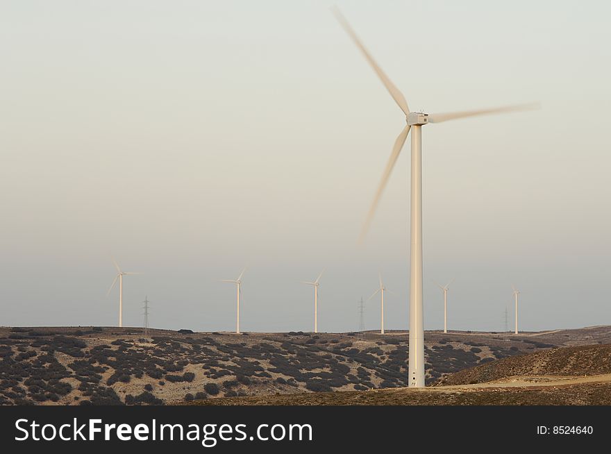 Eloicos group of wind turbines at sunset in Fuendetodos; Spain