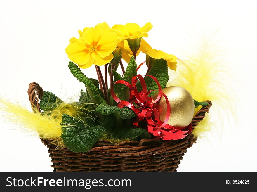 Golden egg with spring yellow flower for easter background. Golden egg with spring yellow flower for easter background.