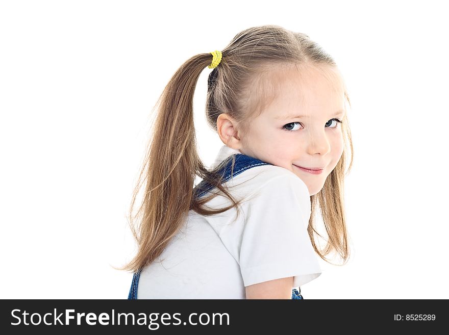 Smiling little girl with ponytails wearing white t-shirt