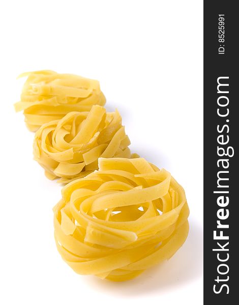 Italian pasta tagliatelle on white background