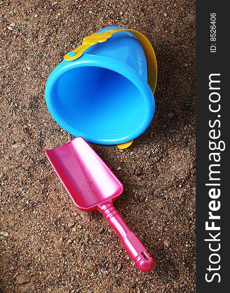 Kids' sand colored toys shovel and bucket. Kids' sand colored toys shovel and bucket