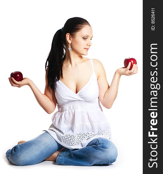 Young woman holding two red apple in her hands. Young woman holding two red apple in her hands
