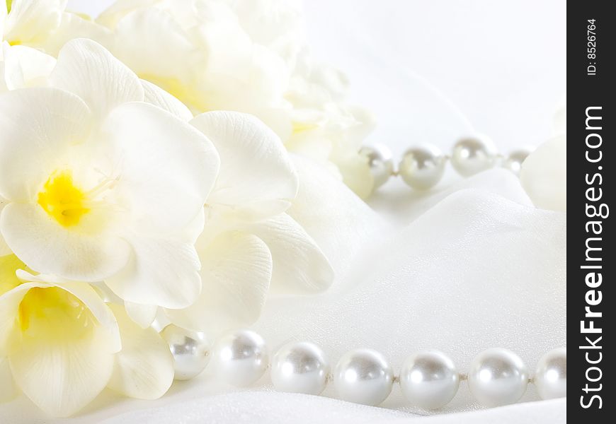 Close up of pearls and white flowers