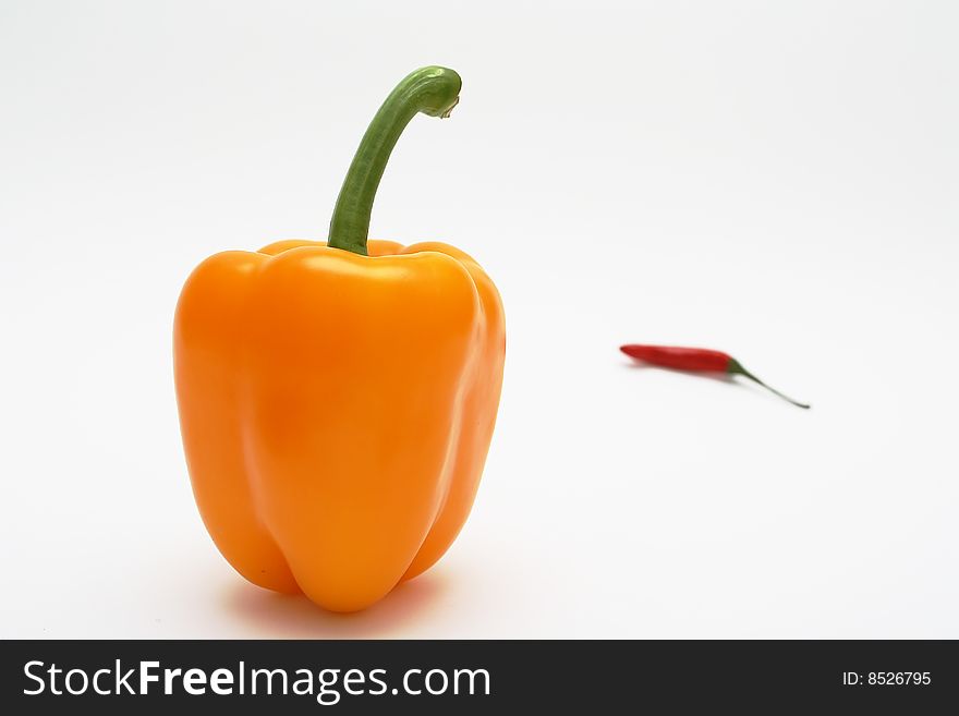 Orange pepper and red chilli pepper