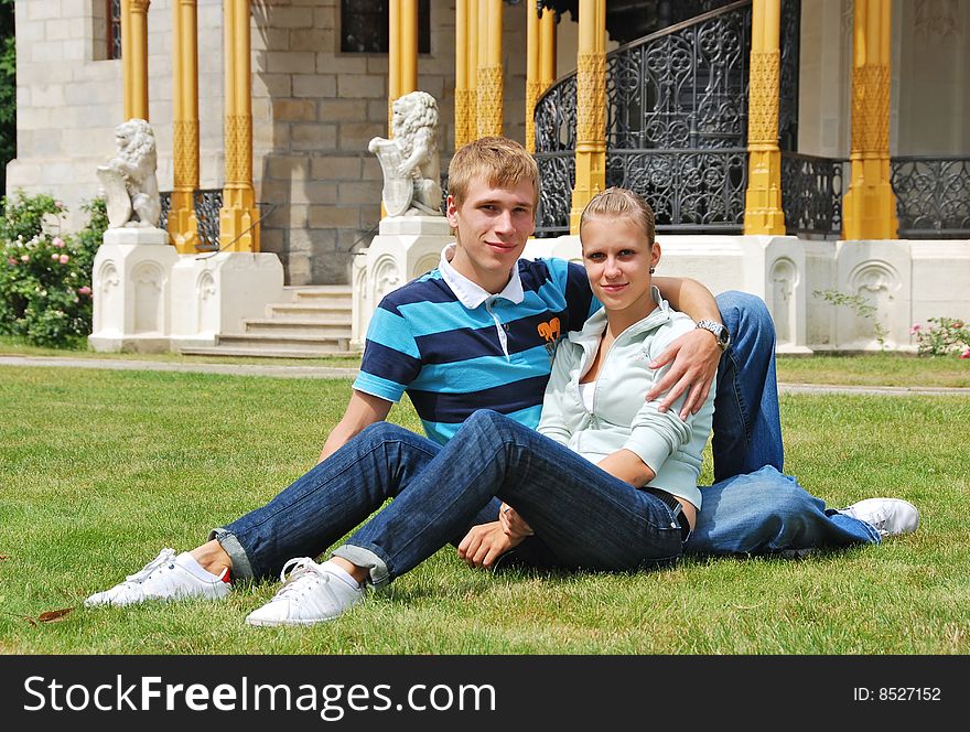 Girl and boy in front of castle