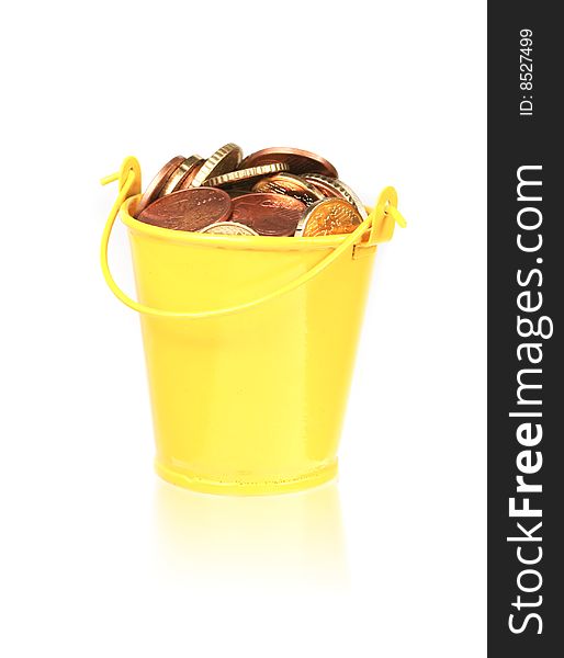 Bucket full of coins isolated on white background. Bucket full of coins isolated on white background.