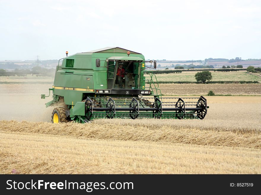 A combine harvester harvesting the field