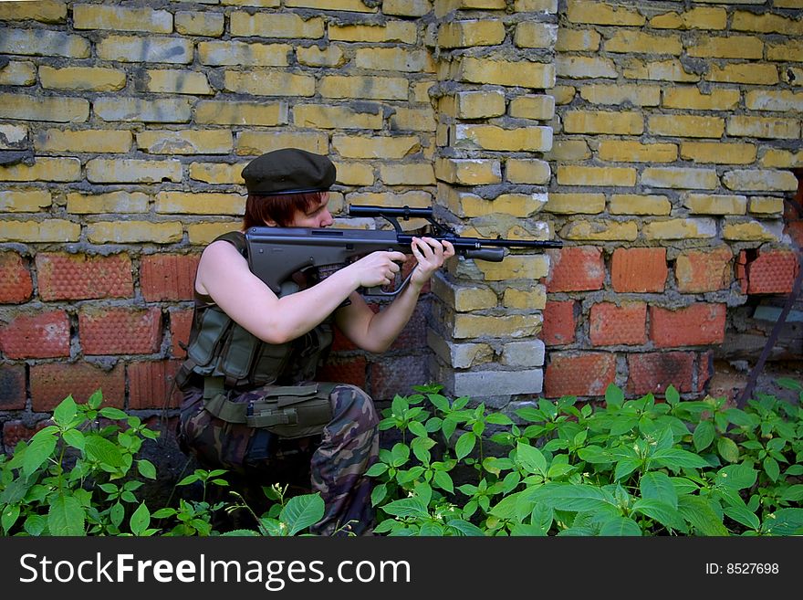 Shooting soldier in front of a wall. Shooting soldier in front of a wall