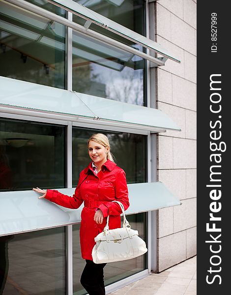 Beautiful young woman in red coat. Beautiful young woman in red coat