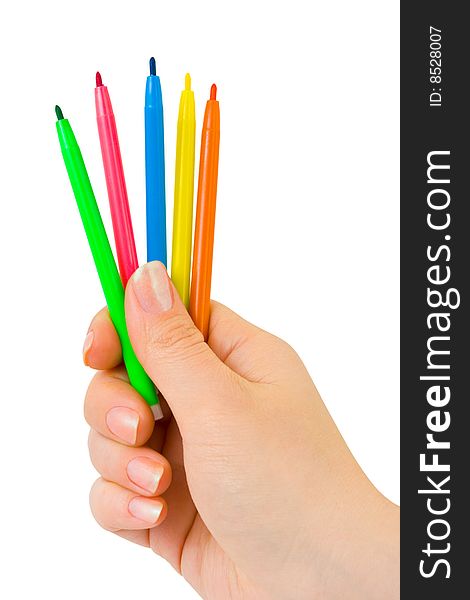 Hand with multicolored pens