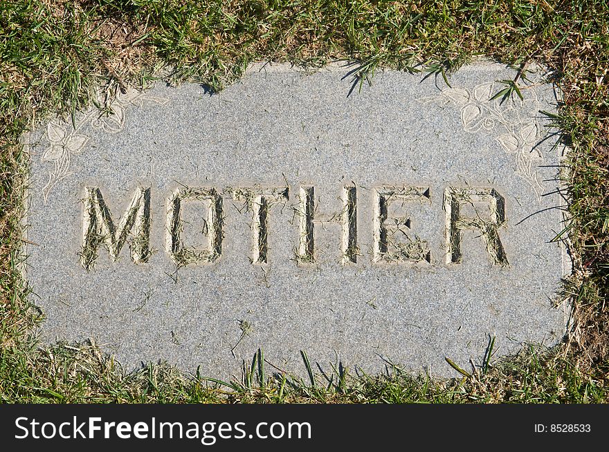 Mother inscription on old grunge granite tombstone. Mother inscription on old grunge granite tombstone.