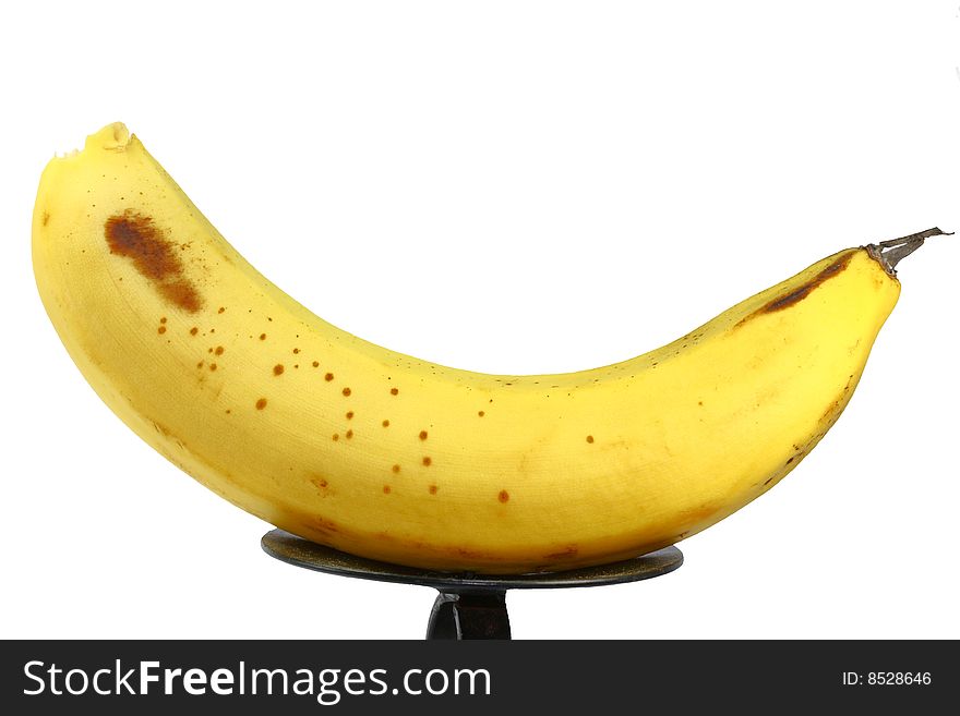A yellow banana on a white background. A yellow banana on a white background