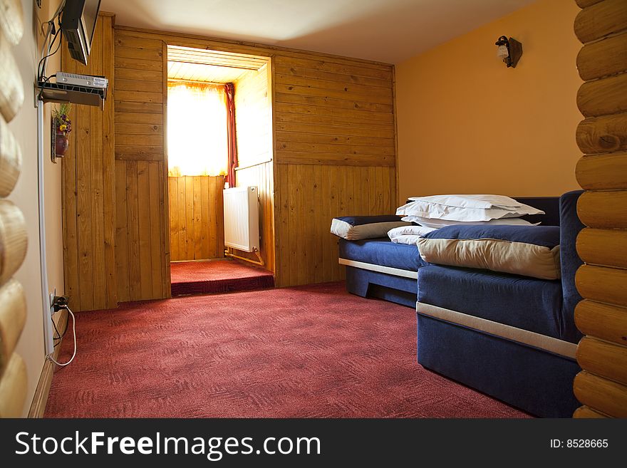 Hotel room with red and beige four stars empty