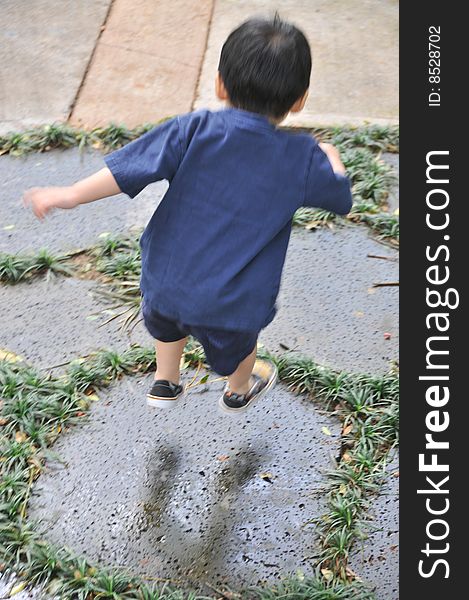 Jumping Boy On Stones