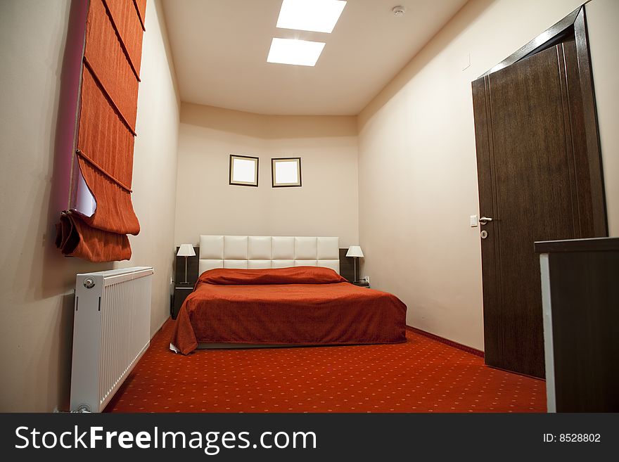 Hotel room with red and beige four stars empty