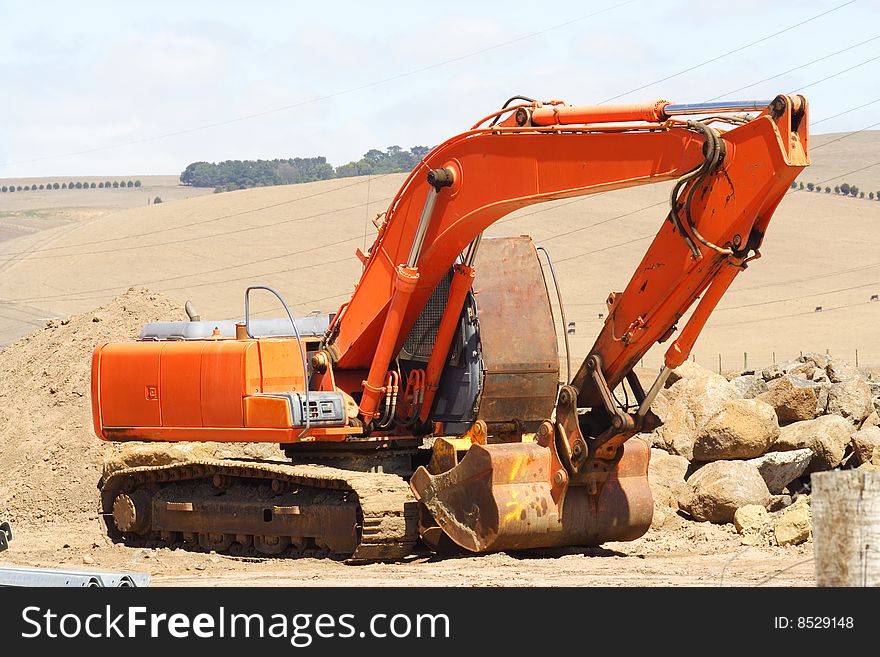 A Large orange earth mover. A Large orange earth mover